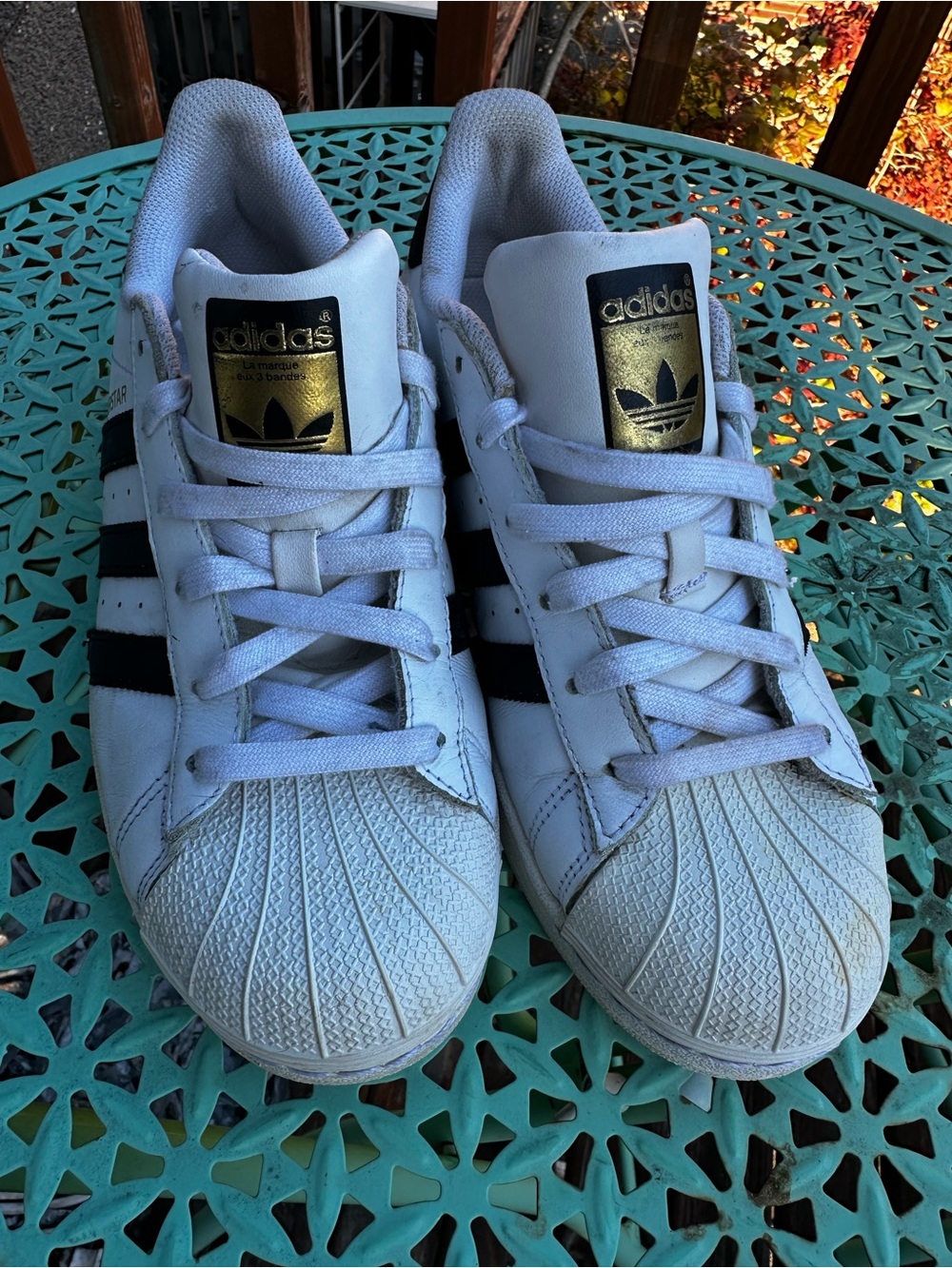 adidas White Sneakers with Black Stripes and Gold Logo